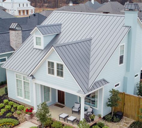 white metal house with black roof|white house with galvalume roof.